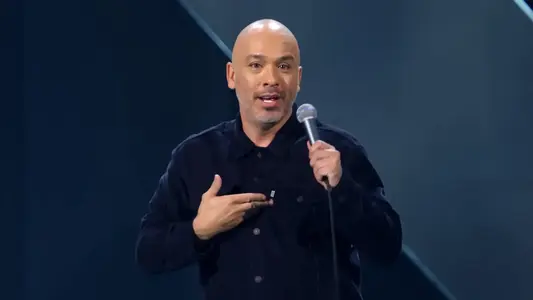 jo Koy Net Worth, Wife, Age, Height, Family and performing his comedy show in black clothes